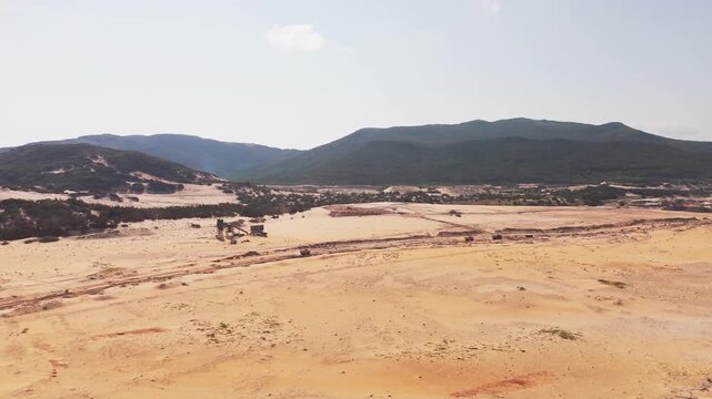 Aerial Drone View of Heavy Construction and Land Development on Vast Sandy Coastal Terrain at Bai Hon Cat Tham, Khanh Hoa Province, Central Vietnam, Southeast Asia