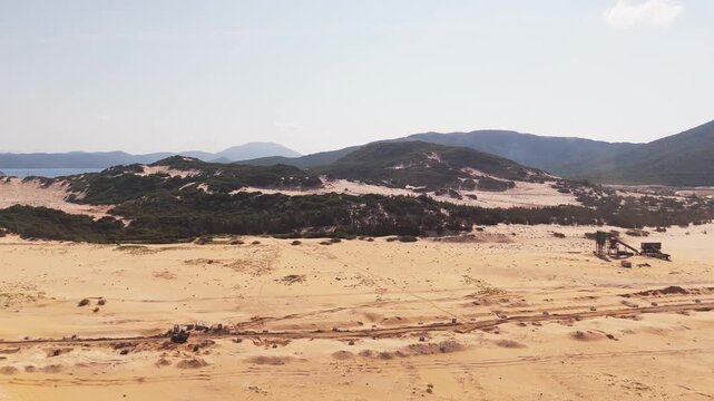 Aerial Drone View of Heavy Construction and Land Development on Vast Sandy Coastal Terrain at Bai Hon Cat Tham, Khanh Hoa Province, Central Vietnam, Southeast Asia
