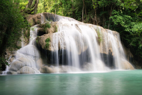 Erawan Waterfall Tier 2 at Wang Macha is popular travel destination in Kanchanaburi Province, Thailand, natural beauty and serene atmosphere. Surrounded by lush green forest and tropical foliage.