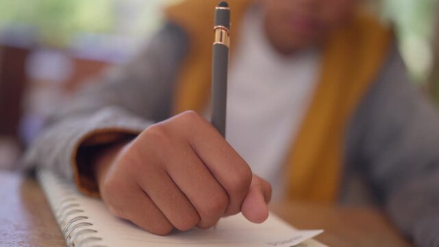 Young student studying seriously at home preparing for future success. Concept of education journey, ambition, discipline, and achieving academic goals in cinematic storytelling style.