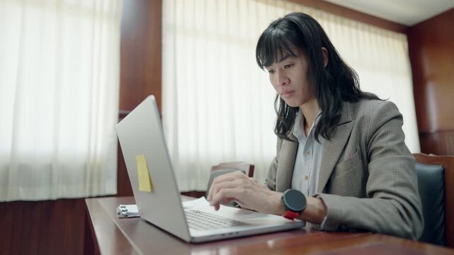 Corporate lawyer working on compliance and legal regulations in business environment. Concept of governance, risk management, and professional legal advisory services.