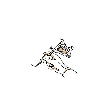 Hand holding tattoo machine while creating design on skin  