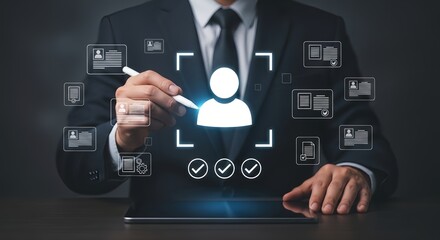 Fototapeta premium A businessman in a suit interacts with a digital interface on a tablet, symbolizing modern technology and data management.