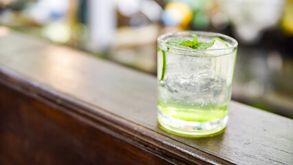 Refreshing Cocktail with Lime and Mint on Wood Bar © Rahayu