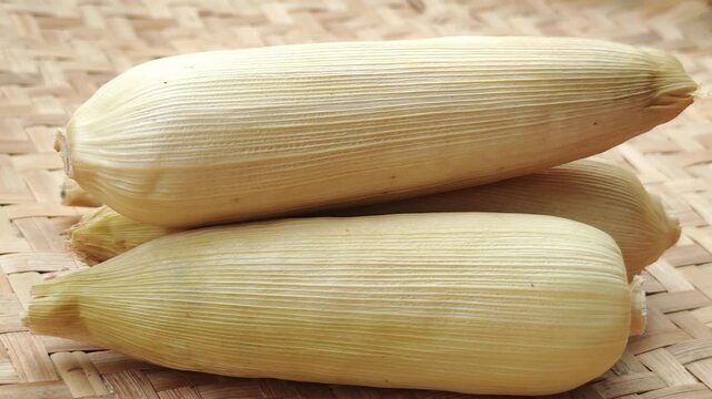 Boiled White corn on white background close up

