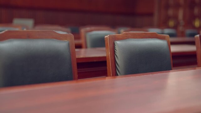 Courtroom setting used as concept for law education and legal studies. Represents academic learning, law school environment, and student training in judicial system.