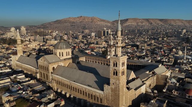 Cinematic perspective of the interior destruction of a war-torn structure in Syria, documenting war impact