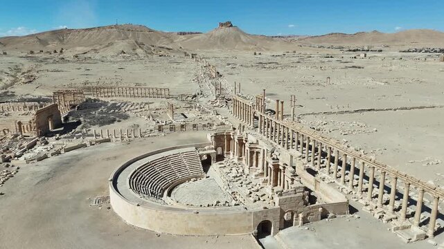 Stunning high-angle drone view of the ancient Roman Theatre in Palmyra, a UNESCO World Heritage site in the Syrian desert