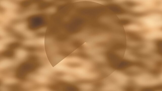 Abstract image of a blurry brown/beige background with an oval shape