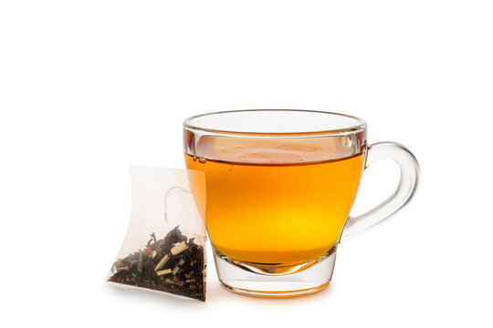 Glass cup of tea with tea bag isolated on white background.