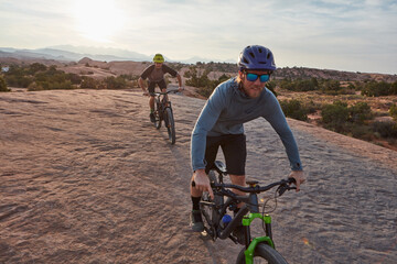 Obraz premium People, sports and cycling in nature with mountain bike, adventure or workout together for fitness. Active, friends and countryside journey with bicycle, rock terrain or cardio exercise for wellness.