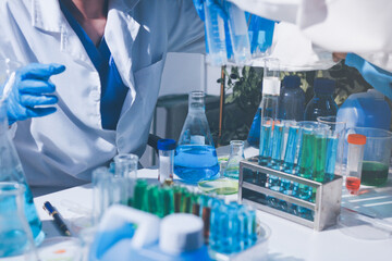 Fototapeta premium Science, laboratory and woman with pipette, test tube and biotech solution in research. Medical innovation, scientist or lab technician in study for healthcare, medicine and vaccine results feedback.