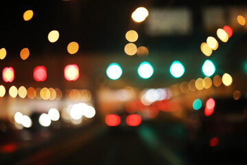 Fototapeta premium De focused/blur image of city at night. De focused, blurred urban abstract traffic background.