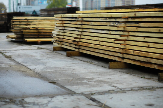 Outdoor lumber storage for the timber industry. Wood processing for both land and water transportation.