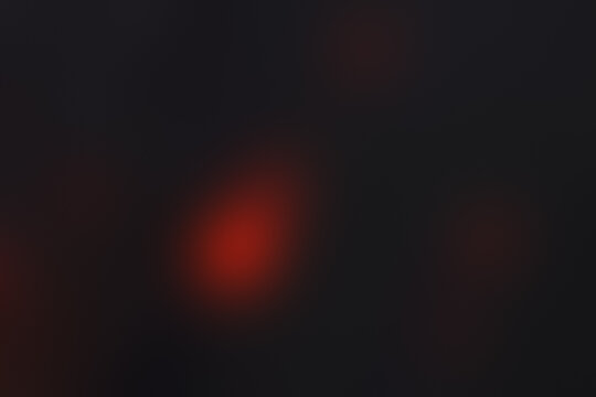 Soft dark background with subtle red bokeh glow and minimalist blur.