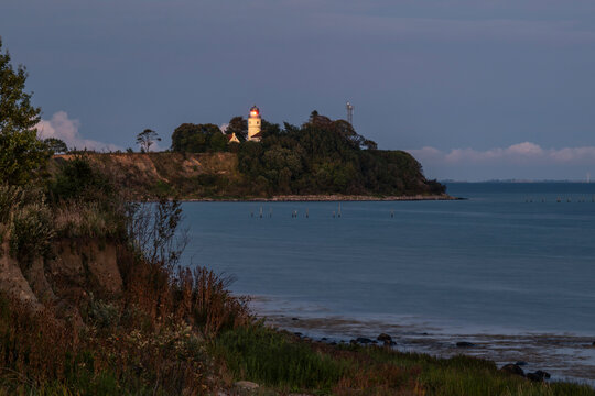 Kegn�s lighthouse on the coast of the Danish peninsula at dusk