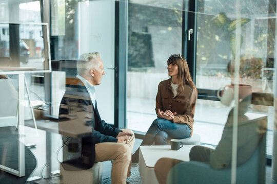 Team meeting in modern agency discussing business collaboration