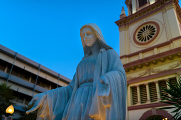 Fototapeta premium Santa Cruz Church illuminated at twilight , Historic Thai-Portuguese Neighborhood Dating Back to the Ayutthaya Period, in Bangkok, Thailand.