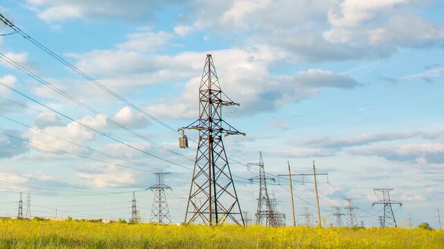 Timelapse of large power line towers in sunny, electric
