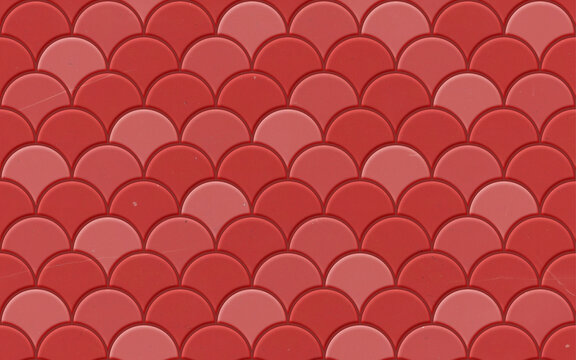 Seamless pattern. Bright red scallop tile wall and floor texture. Fish scale pattern. Tileable background. 