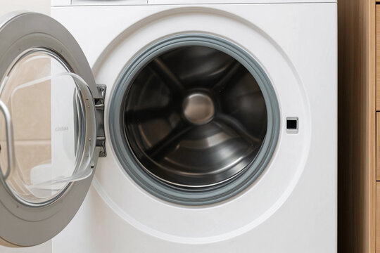 White Washing Machine With Open Door in a Laundry Room.