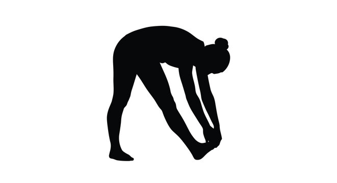 Woman performing a forward bend yoga pose striking black silhouette