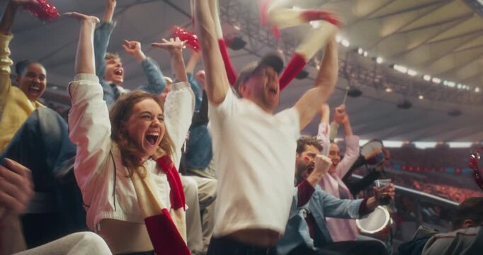 Diverse Fans Cheer and Celebrate in a Packed Stadium During a Soccer Championship Game. Team in a Professional Sport Arena as a Goal Leads to Victory Joy at a Major International League Match