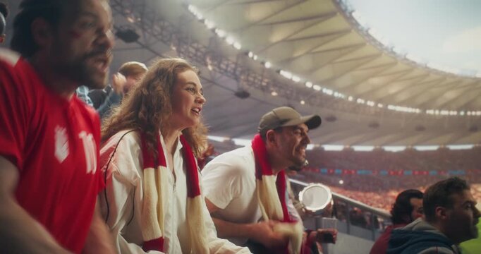 Diverse Fans in a Packed Stadium Cheer and Celebrate a Soccer Goal During a Championship Sport Event, Backing Their Team in a Professional Arena at a Major International League Match.
