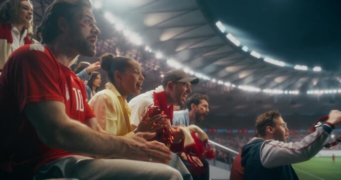 Portrait of Happy Multicultural Soccer Fans Cheering and Applauding in a Packed Stadium During a Professional International League Championship Match, With Confetti and Scarves, Slow Motion.