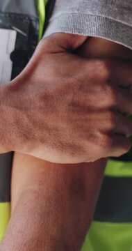 Construction, hands and arm pain with injury from work accident, inflammation and pinched nerve. Engineer closeup, person and massage muscle on site from manual labor, tendinitis and tricep fracture