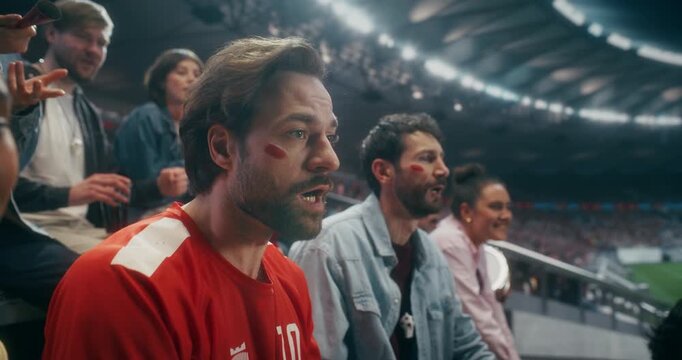Portrait of a Happy White Male Soccer Fan Smiling and Celebrating With Friends in a Packed Stadium During a Professional International League World Event Championship Match, Slow Motion.