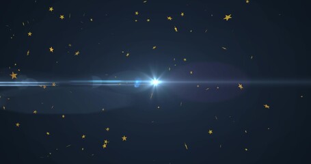 Fototapeta premium Radiating central white-blue flare sending wide lens streaks across navy studio, golden confetti
