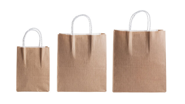 Three brown paper shopping bags of varying sizes, neatly arranged and isolated on transparent background for retail marketing and packaging designs