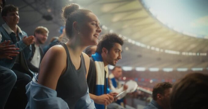 Young White Female Soccer Fan in a Packed Stadium Reacts With Visible Disappointment After Her Team Lost During a Major Championship Match at a Big International Sports Event. Slow Motion Shot
