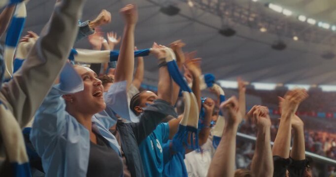 Happy Multiracial Soccer Fans in a Packed Stadium Raise Arms and Cheer at Kickoff of a Professional International League Match, Celebrating the Start of a World Event With Hope for Victory.