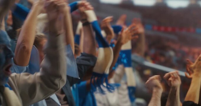 Happy Multiracial Football Fans in a Packed Stadium Raise Arms and Scarves, Cheering at the Start of a Professional International League Match and Celebrating a World Event With Hope for Victory.