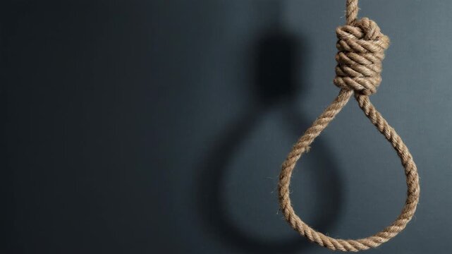 Rope with a hangman's knot swinging slowly, casting a shadow on a dark, dramatic background