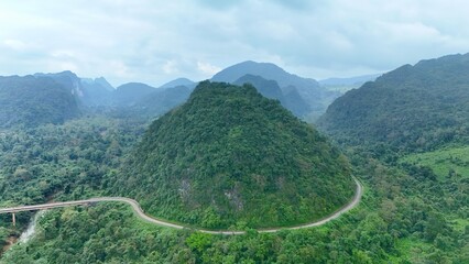 Bo Trach, Quang Binh (Quang Ngai), Vietnam: 4K aerial drone footage of Phong Nha – Ke Bang National Park, UNESCO karst mountains, limestone cliffs, rive, tropical forest, misty valley landscape. © Thomas
