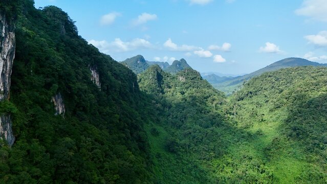 Bo Trach, Quang Binh (Quang Ngai), Vietnam: 4K aerial drone footage of Phong Nha &ndash; Ke Bang National Park, UNESCO karst mountains, limestone cliffs, rive, tropical forest, misty valley landscape.