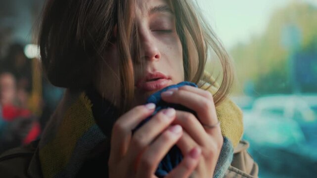 Youthful women quietly grieve, Young females radiating sorrow sit quietly near stationary bus while crying