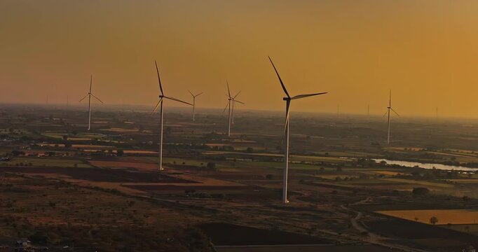 Aerial view of Windmills/ Wind Turbines Operating in Rajkot, Gujarat, India. Renewable energy, Wind Energy Production, Wind Farm in India, Developing India Concept 