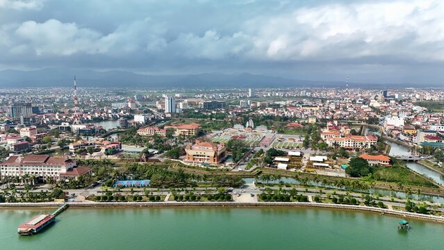 Dong Hoi City, Quang Binh, Vietnam Coastline &ndash; aerial drone view of Nhat Le River, skylines, roads, houses, urban seaside landscape in Central Vietna