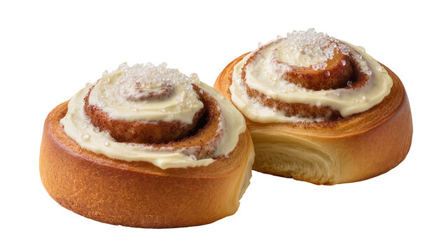 Two golden cinnamon swirl buns generously frosted with creamy icing and sprinkled with sparkling sugar crystals, isolated on transparent background for bakery promotions