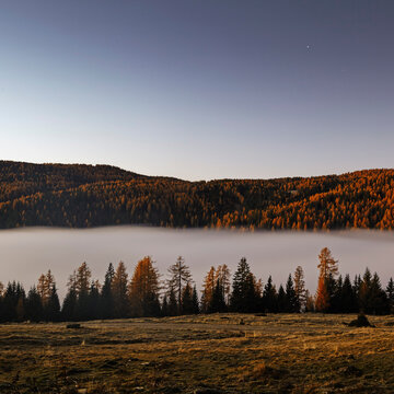 Layer of fog at base of autumn mountain, Salzburg, Austria
