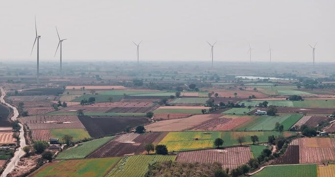 Aerial view of Windmills/ Wind Turbines Operating in Rajkot, Gujarat, India. Renewable energy, Wind Energy Production, Wind Farm in India, Developing India Concept 