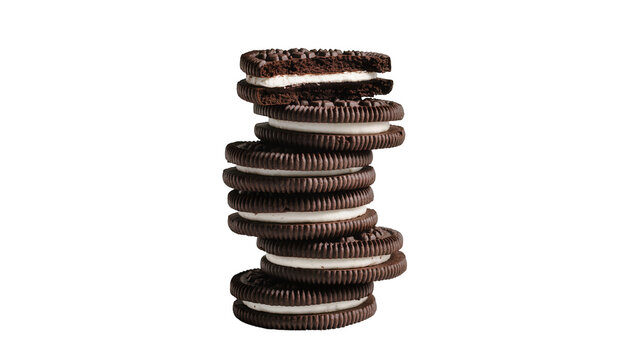 Stacked chocolate Oreo cookies with creamy vanilla filling, perfectly arranged in a tower isolated on transparent background for dessert promotions