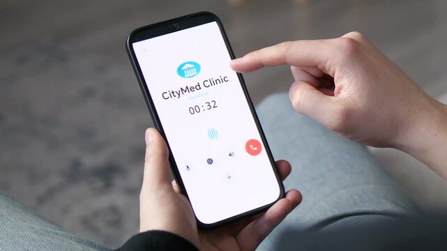 Close-up of a person contacting a clinic support line on mobile. Screen features call timer and voice waveform. Ideal for medical insurance, patient care, and e-health communication marketing