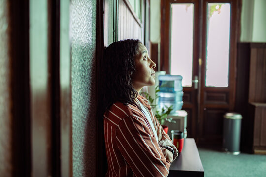 Anxious woman waiting for group therapy session in counseling center hallway