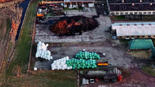 Agricultural farm facility processing organic waste and storing silage bales