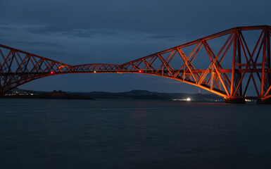 Fototapeta premium The Forth Rail Bridge at dusk over Firth of Forth, Edinburgh, Scotland, United Kingdom